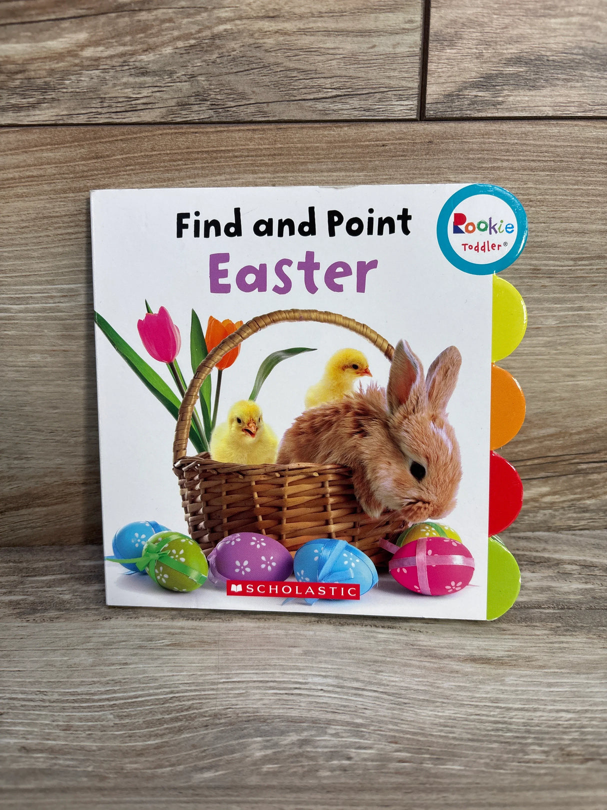 Children's Easter find and point board book with bunny, chicks, tulips, and decorated eggs on wooden floor