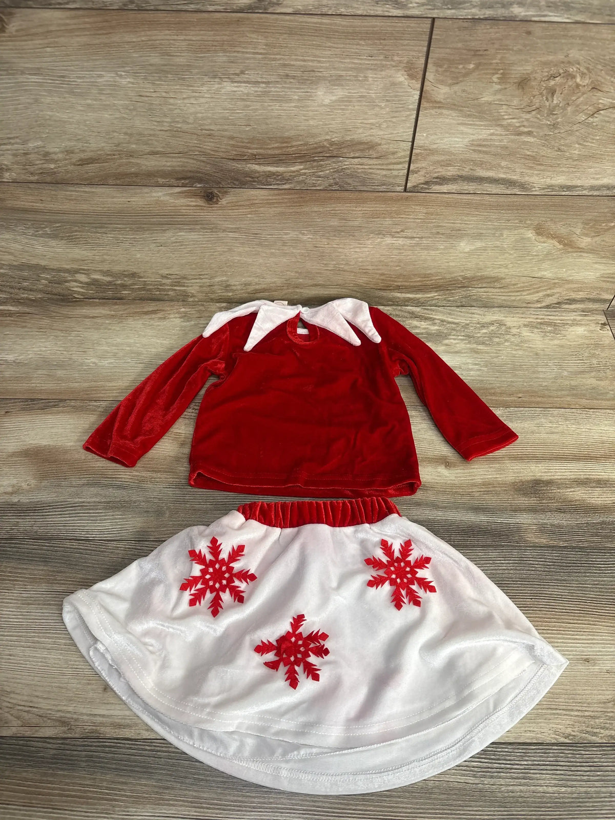 Red velvet top with white collar and white skirt with red snowflakes for kids holiday wear