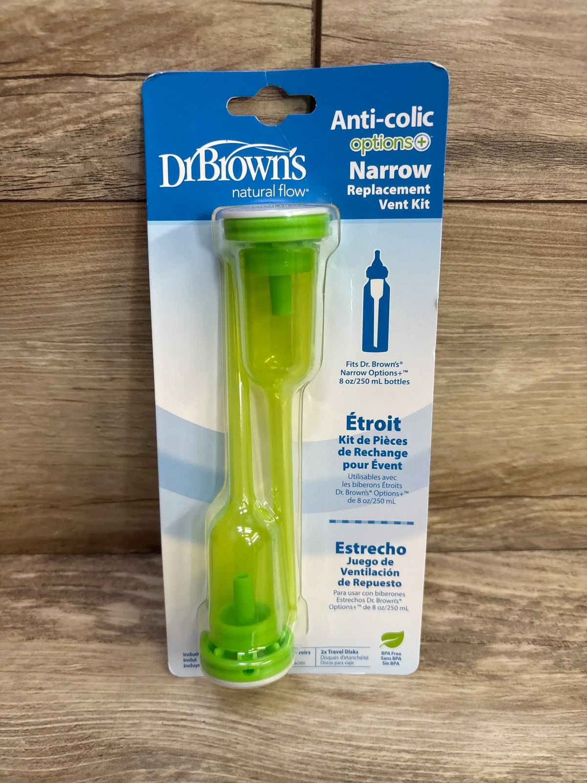 Front view of Dr. Brown’s Options+ Narrow replacement vent kit in blister pack showing two green vent tubes on wood background