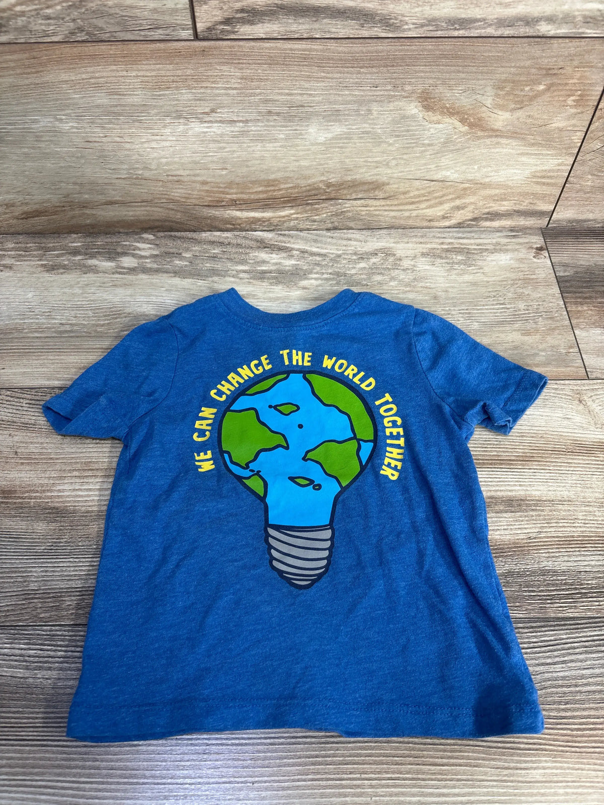 Front view of Old Navy blue toddler graphic tee showcasing Earth light bulb and We Can Change The World Together text