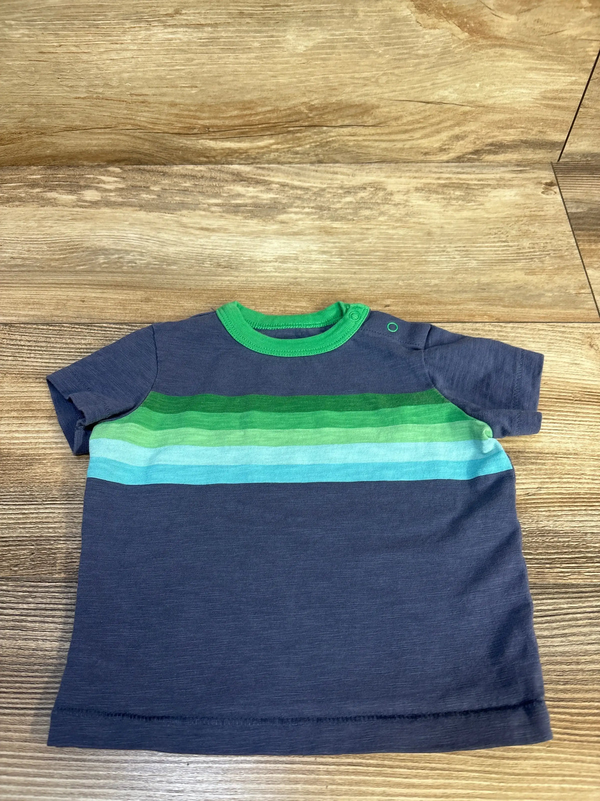 Navy blue short sleeve toddler shirt with green and blue horizontal stripes