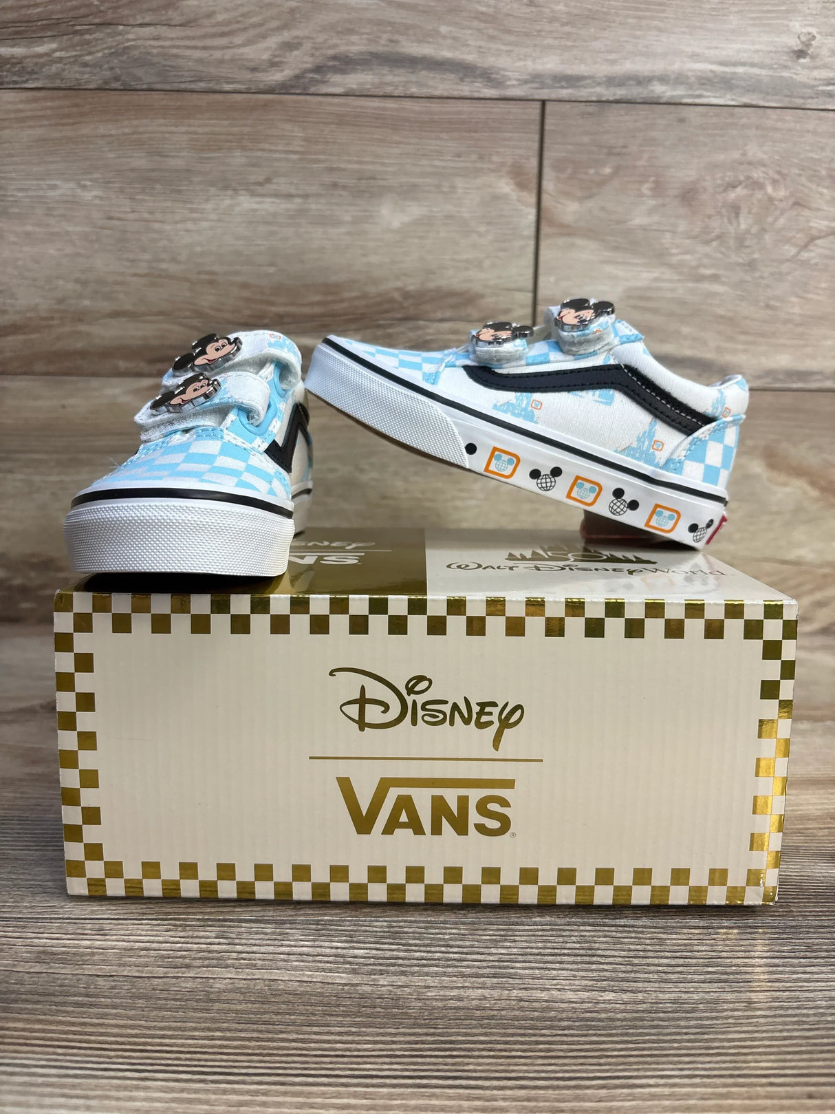 Disney Vans toddler sneakers with Mickey pins, blue checkered design, on branded box
