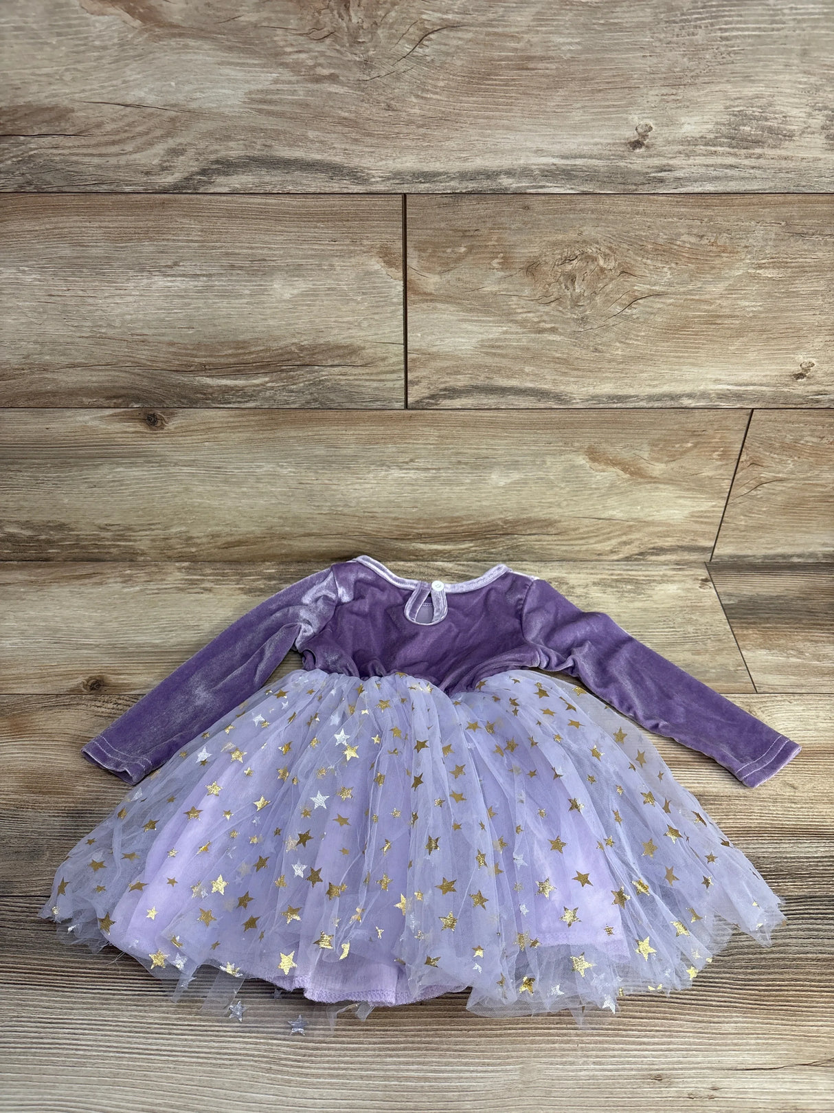 Purple velvet toddler dress with gold star tulle skirt, perfect for kids' parties or special occasions.