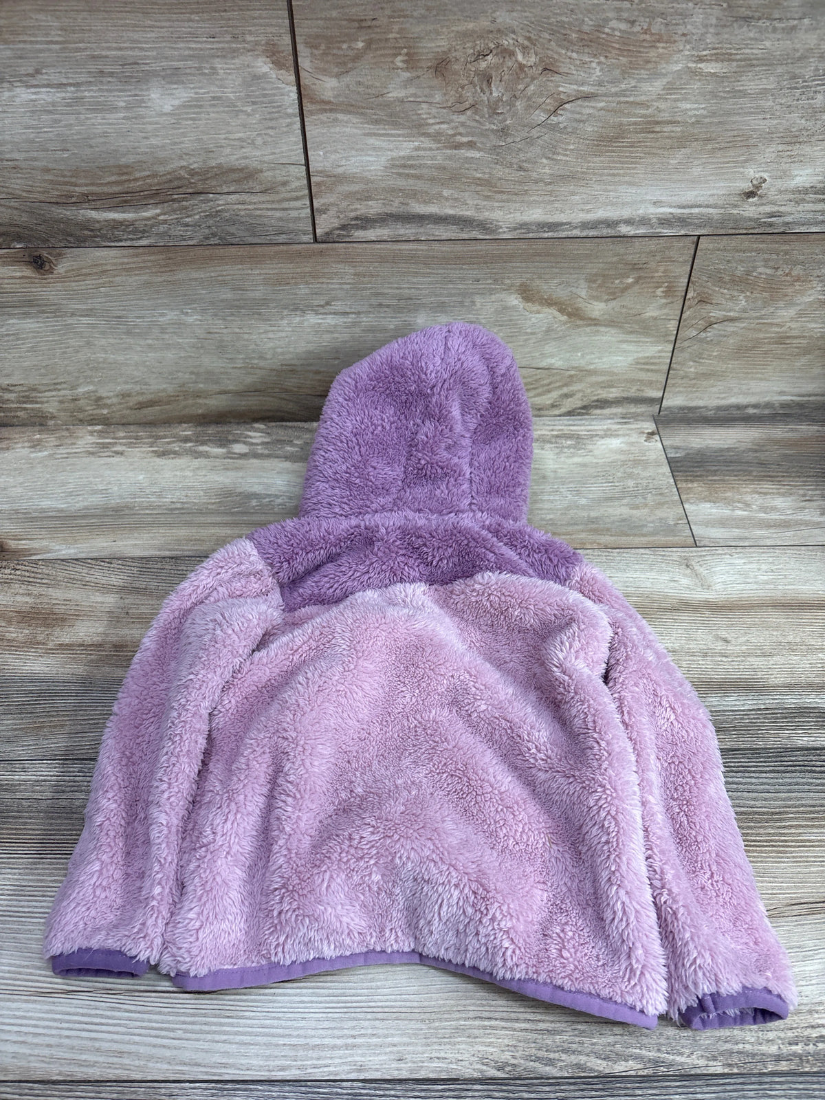 Purple plush hooded jacket for toddlers by Me n Mommy To Be on a wood background
