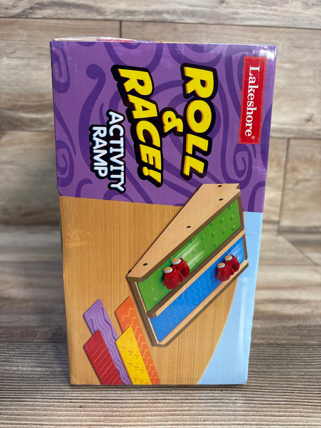 Lakeshore Roll & Race Activity Ramp toy box with ramp and colorful textured tracks