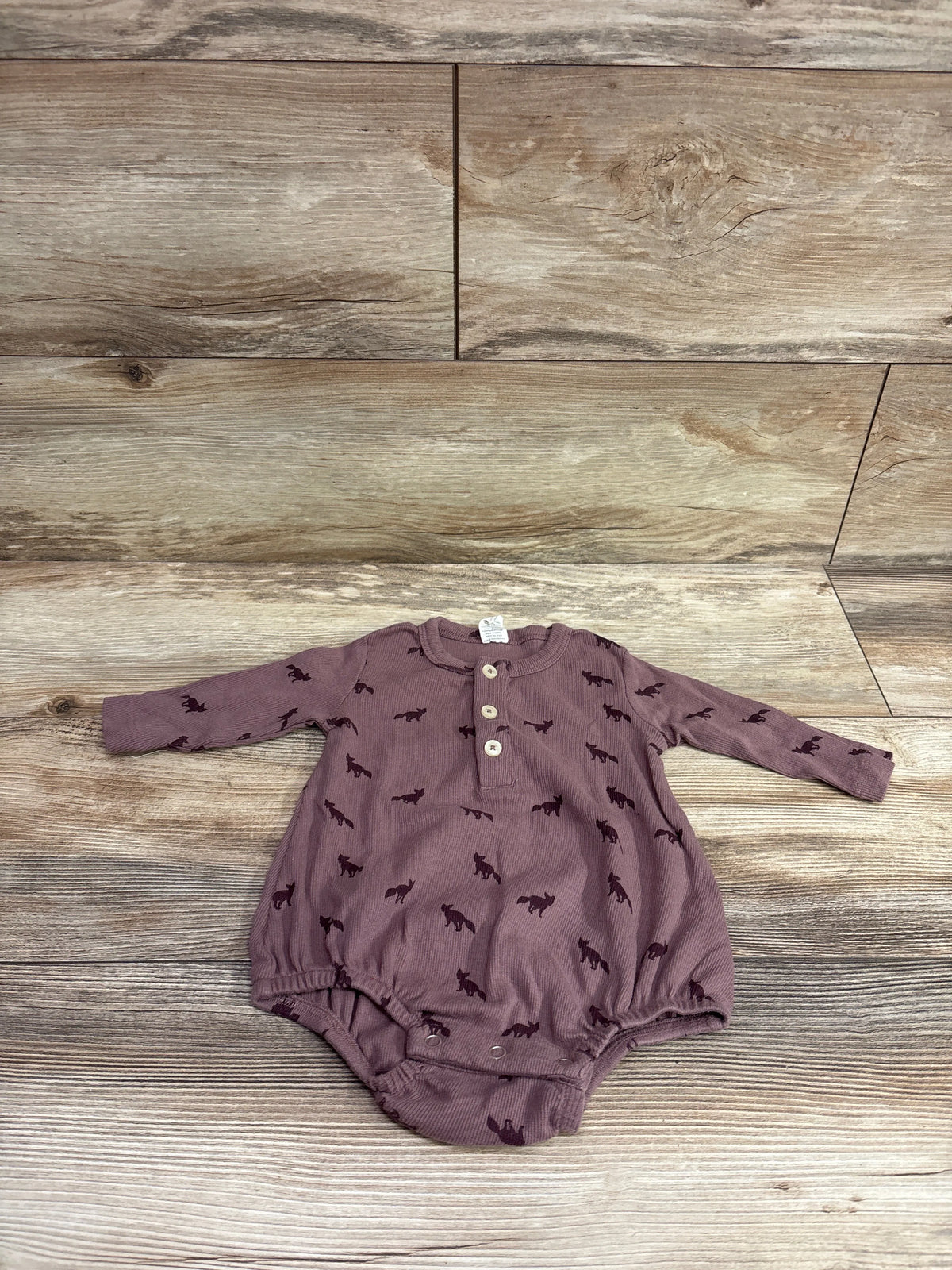 Kate Quinn purple long sleeve ribbed henley bubble romper with fox print on wooden background