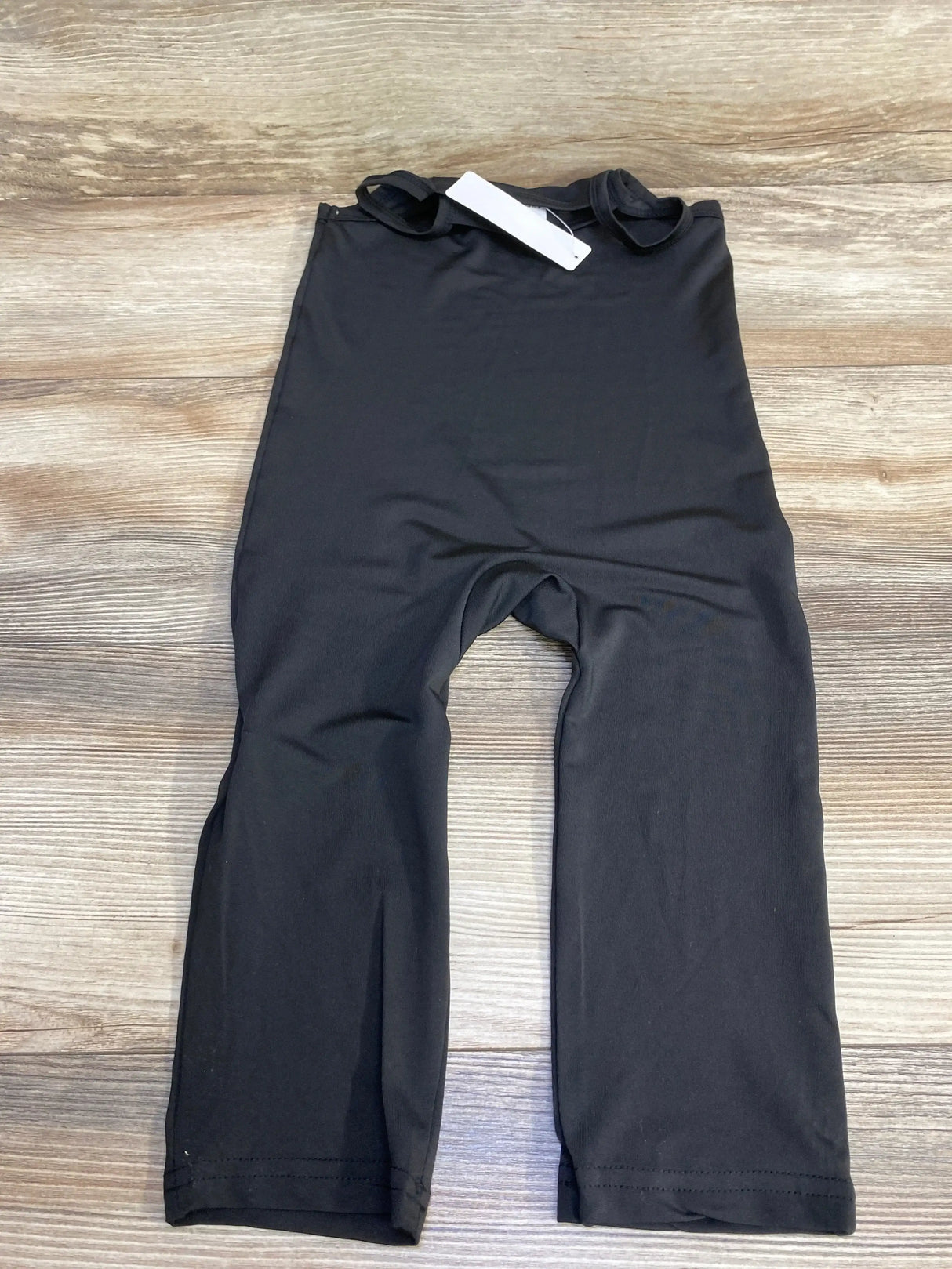 Front view of black Shein baby jumpsuit, 18–24 months, short sleeves and snap crotch on white background