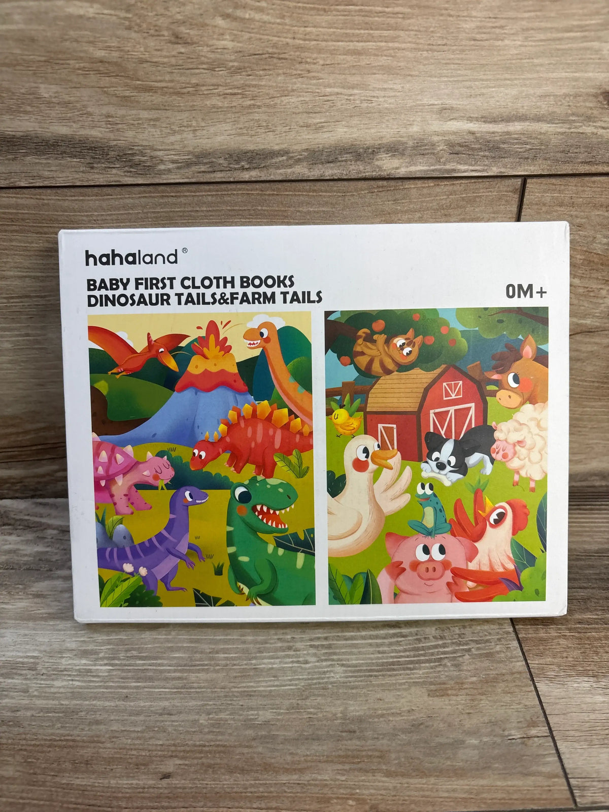 Front view of HahaLand two-pack baby first cloth books showcasing Dinosaur Tails and Farm Tails covers with a wood grain background