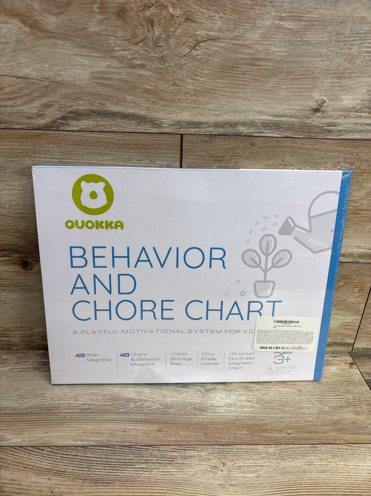 Quokka behavior and chore chart kit for kids, boxed on wooden floor.