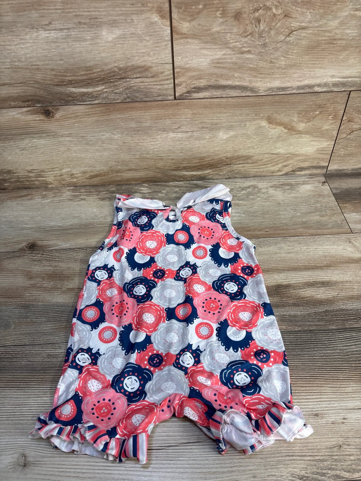 Front view of Pete + Lucy shortie romper in grey, size 12 to 18 months, with floral print and ruffled hems