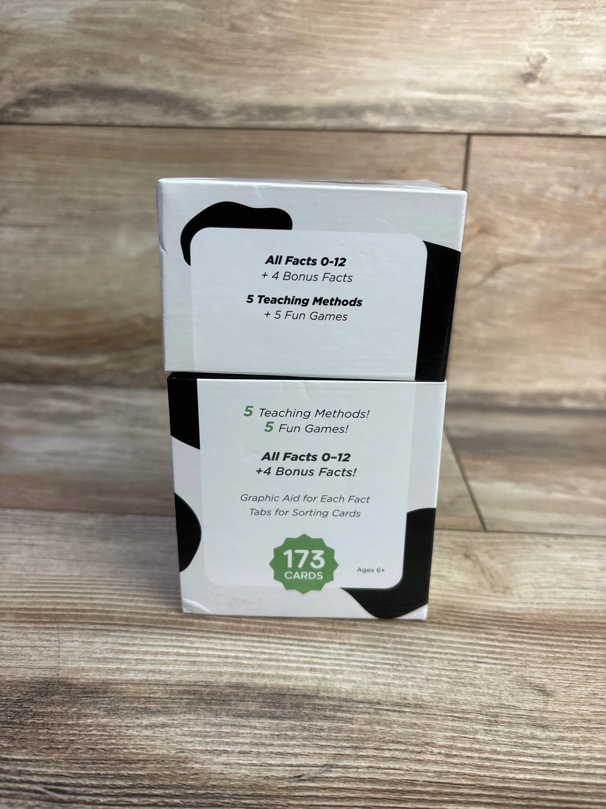 Front of Think Tank Scholar addition flash cards showing All Facts 0-12 plus 4 Bonus Facts and 173 cards badge on wood floor