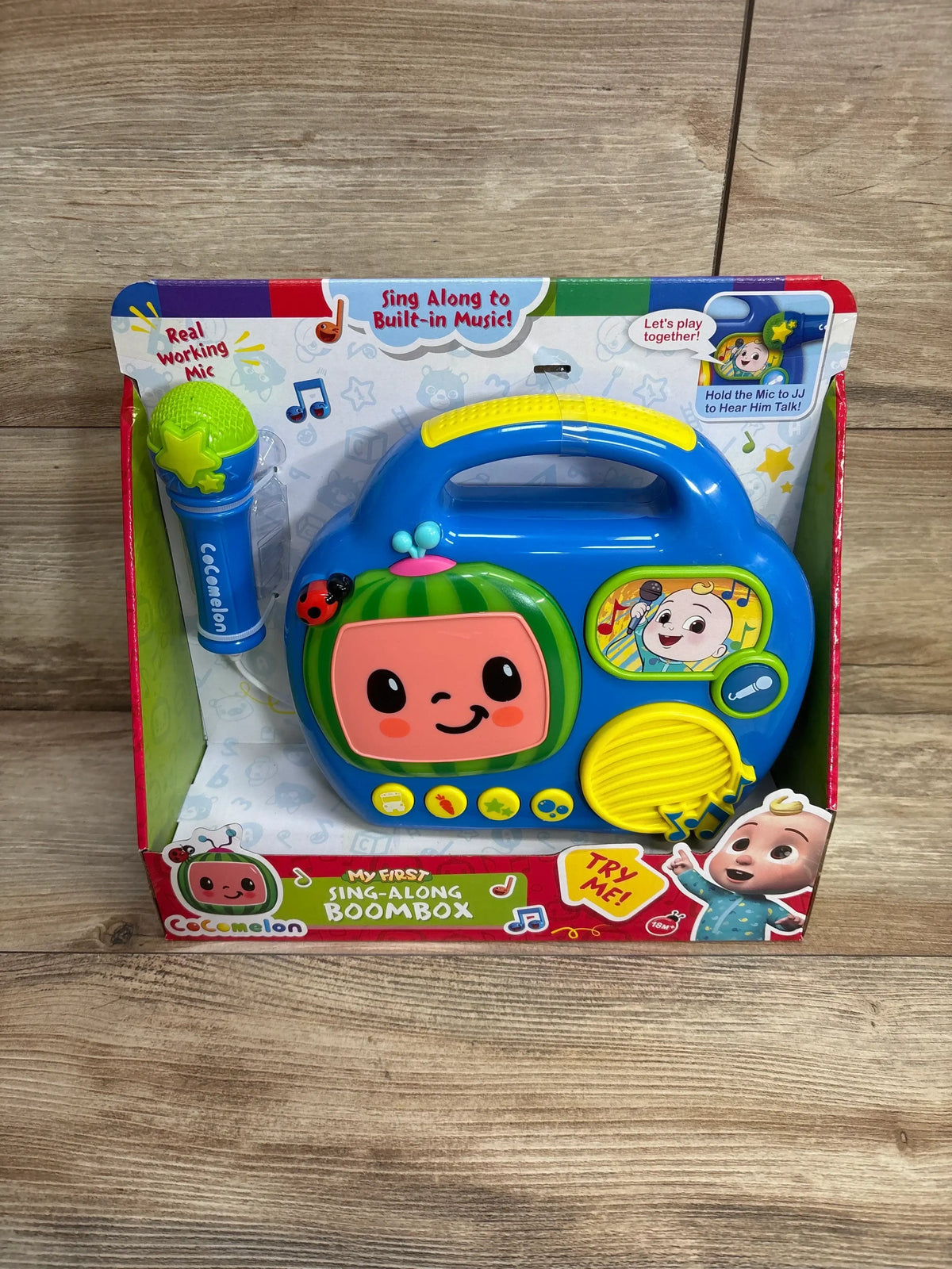 Front view of Cocomelon My First Sing-Along Boombox showcasing built-in music and working microphone on wooden floor