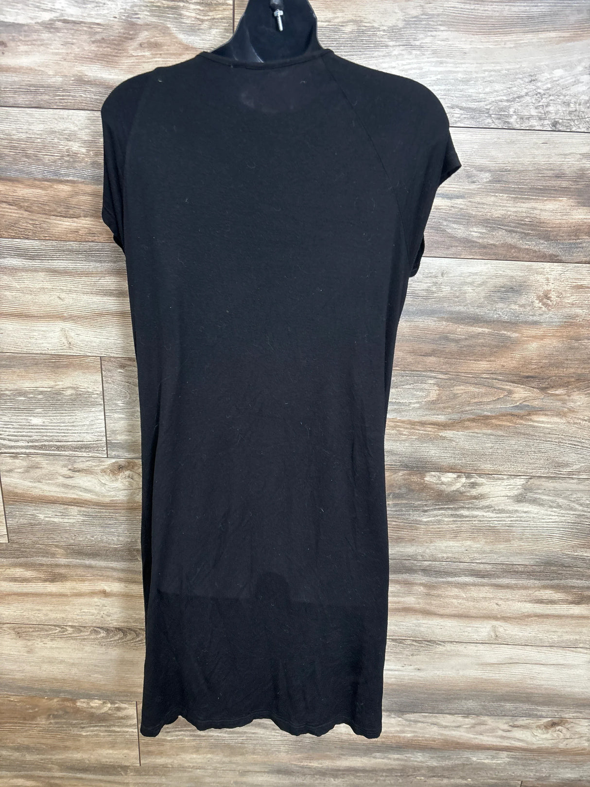 Front view of black Ekouaer 3-in-1 maternity hospital gown, size small, short sleeves and t-shirt silhouette on hanger against wood background