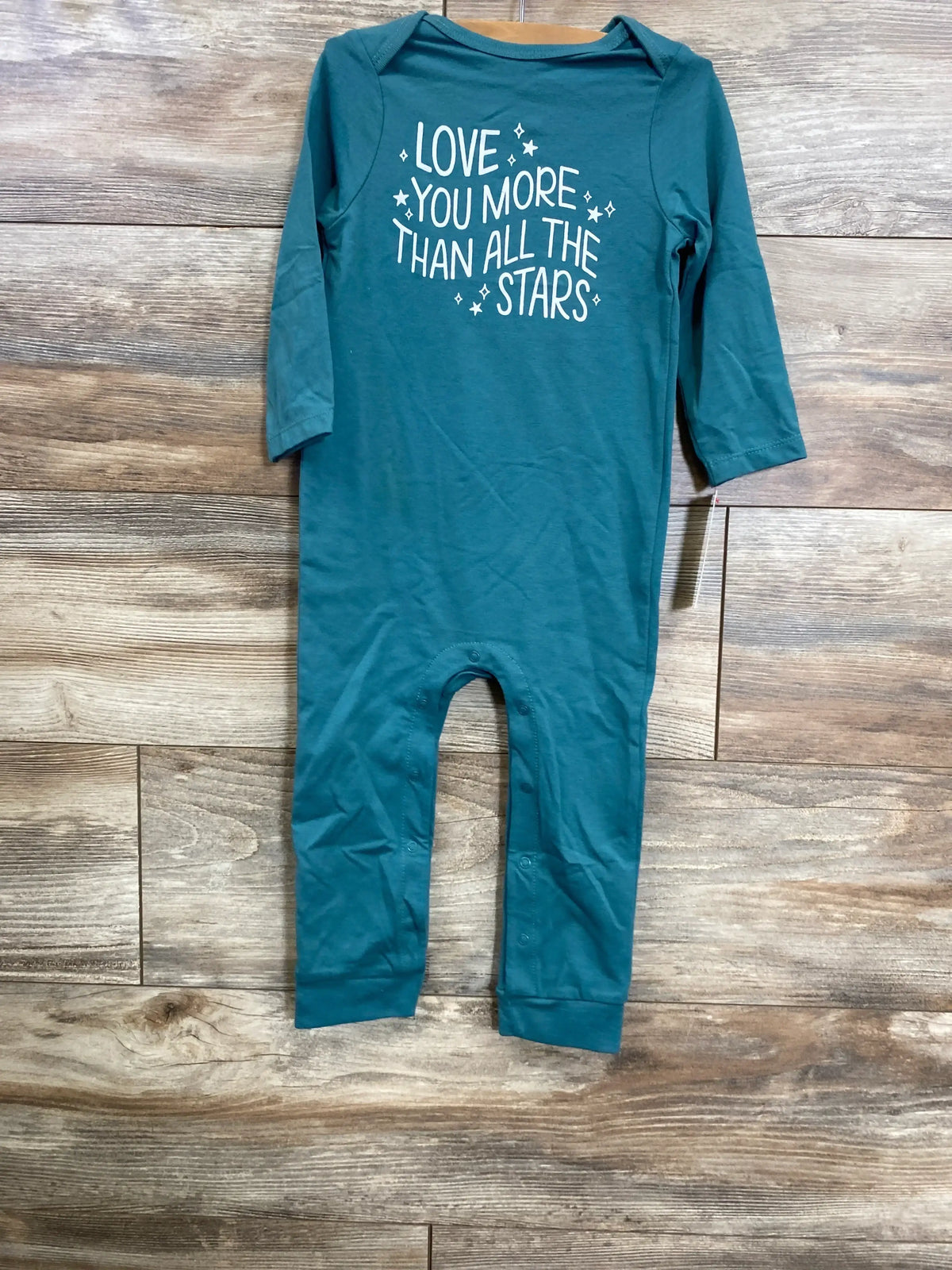 Teal baby romper with 'Love you more than all the stars' text, long sleeves, wooden floor background