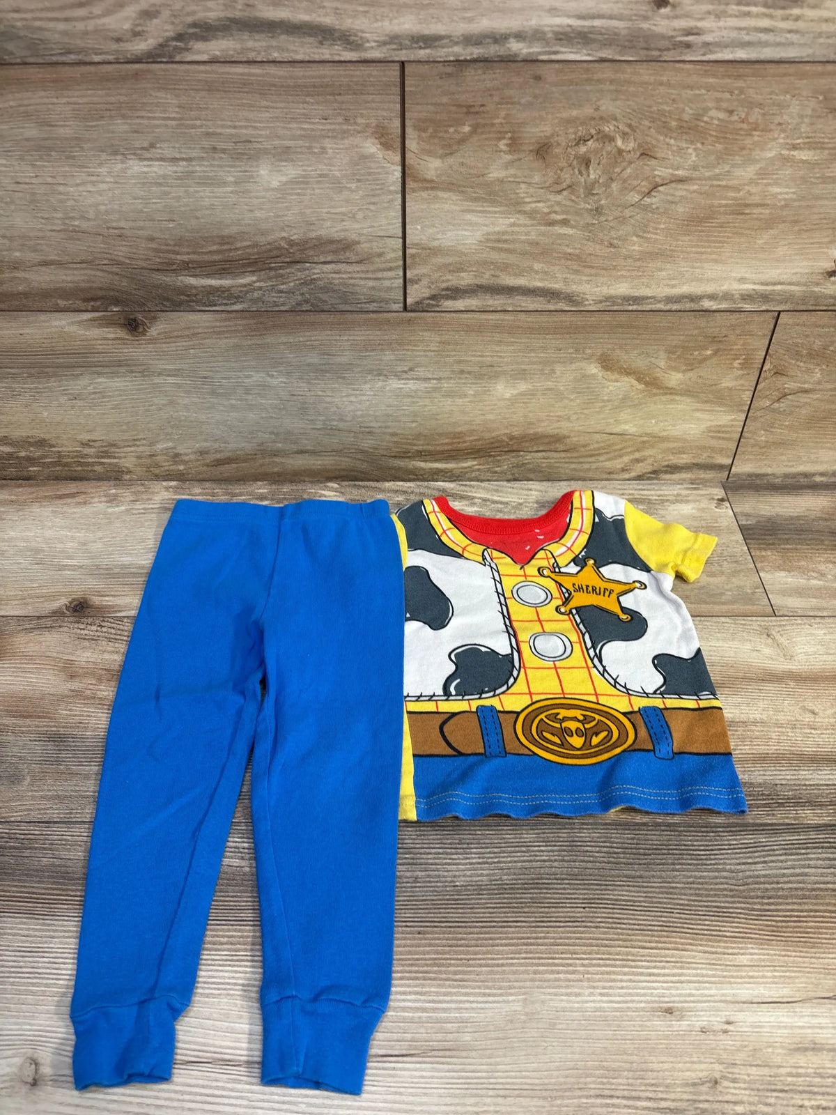 Disney Pixar Toy Story 2-piece pajama set for toddlers featuring Woody's outfit and blue pants