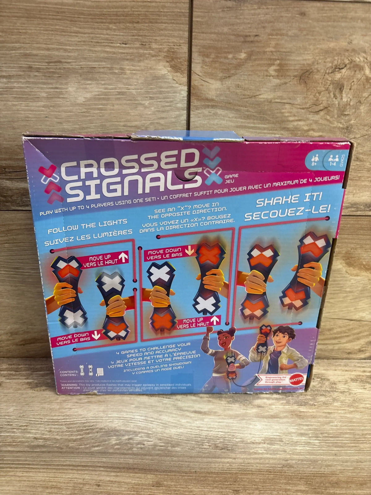 Back of Crossed Signals electronic game box showing instructions, game modes, and players.