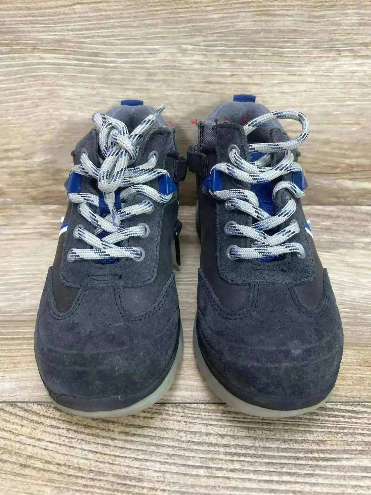 Front view of Mayoral Colorblock City sneakers, gray suede with blue accents and patterned gray laces on wood background
