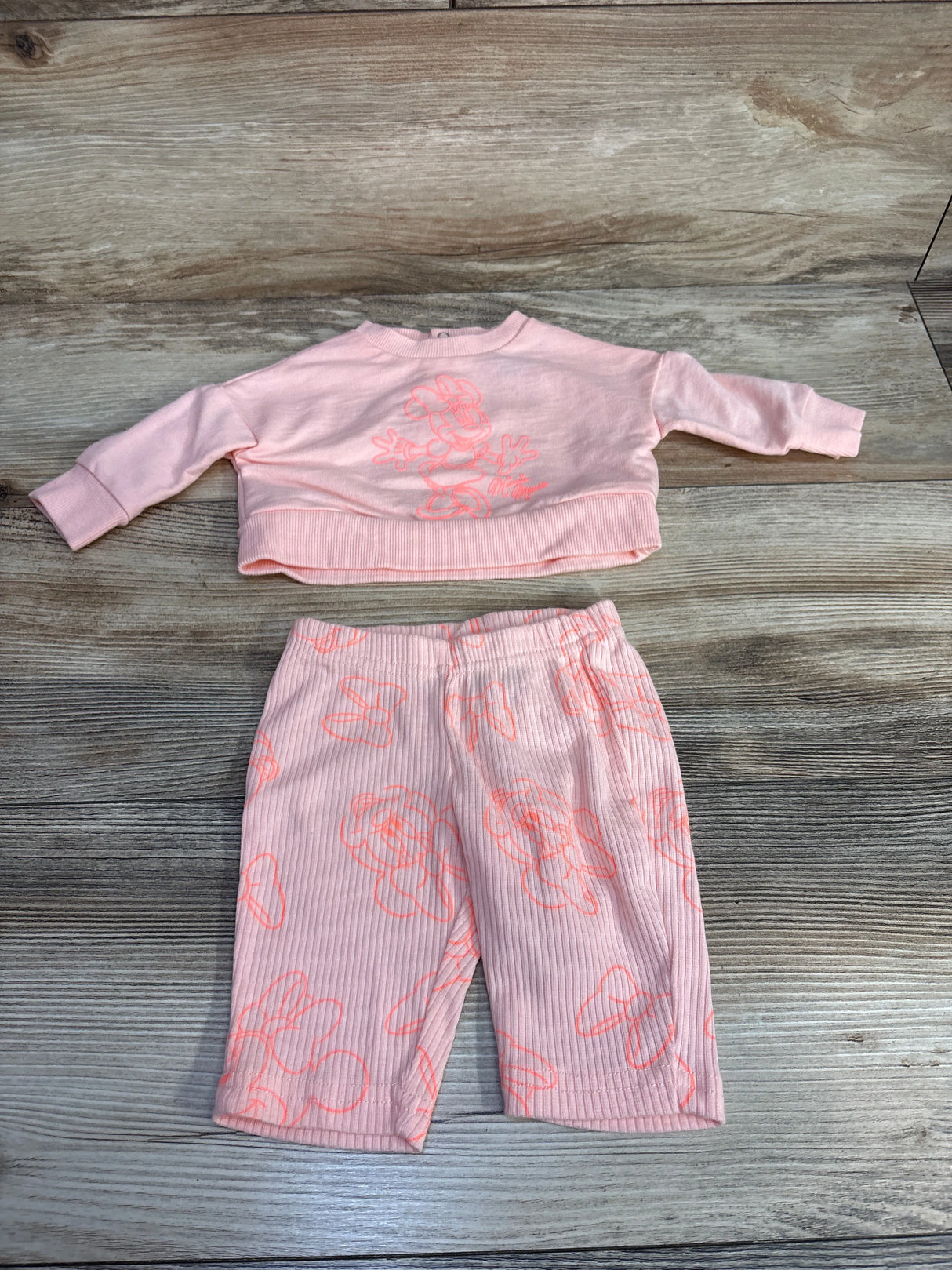Pink toddler outfit with long sleeve top and pants featuring neon pink Minnie Mouse prints
