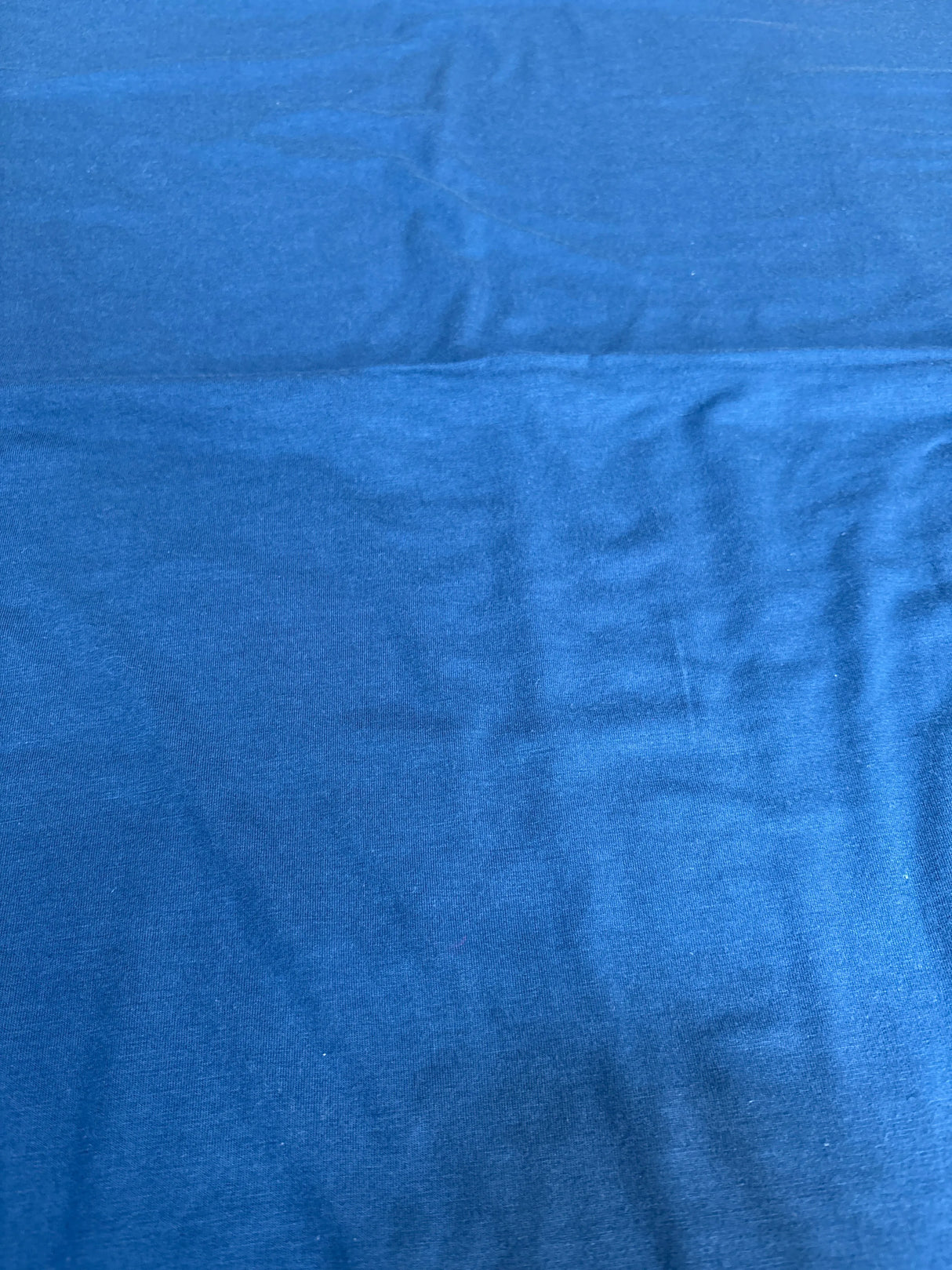 Solid blue kids or maternity clothing fabric, soft texture, resale item