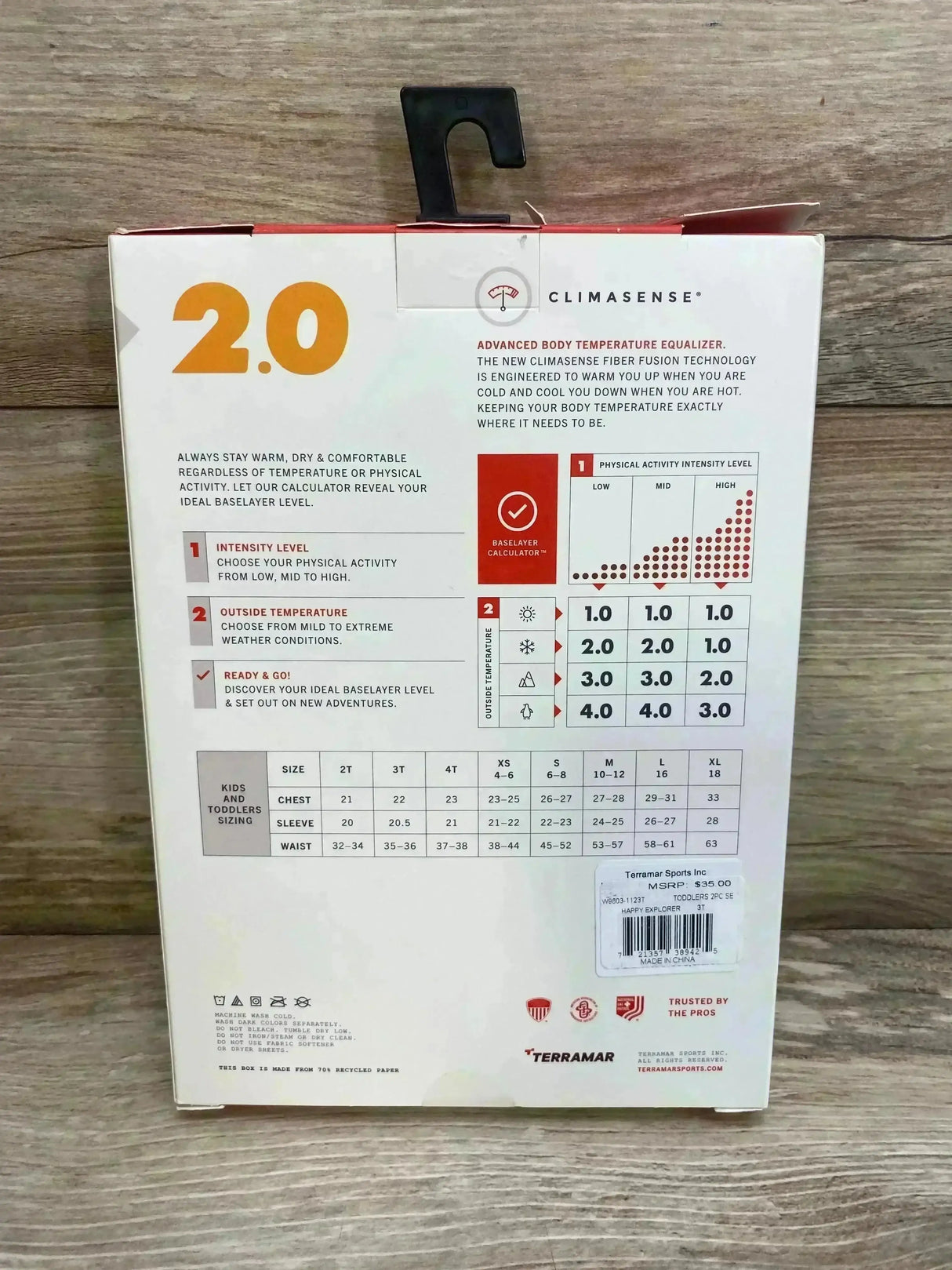 Back of Terramar mid-weight 2pc base layer box (size 3T) showing 2.0 logo, ClimaSense text and kids sizing chart on wood