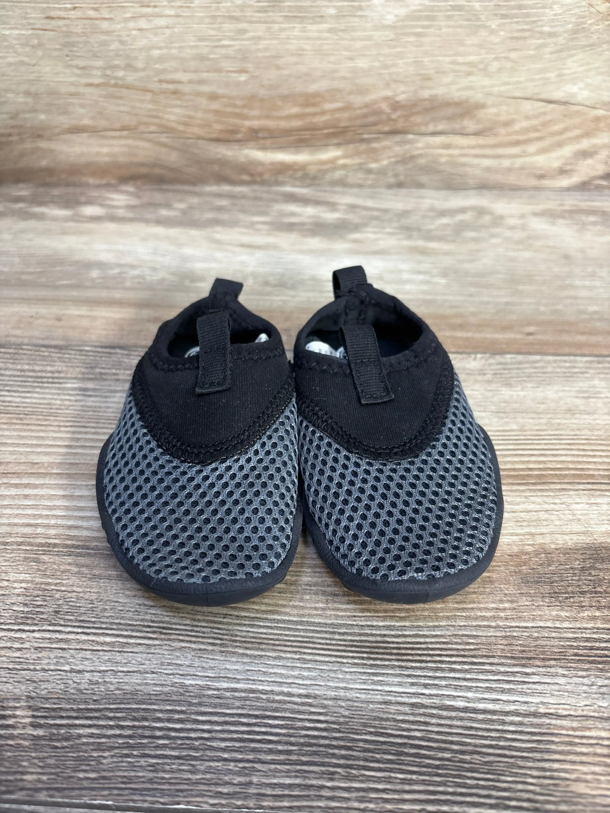 Wonder Nation aqua sock water shoes in grey, size 5/6c, on a wooden surface.