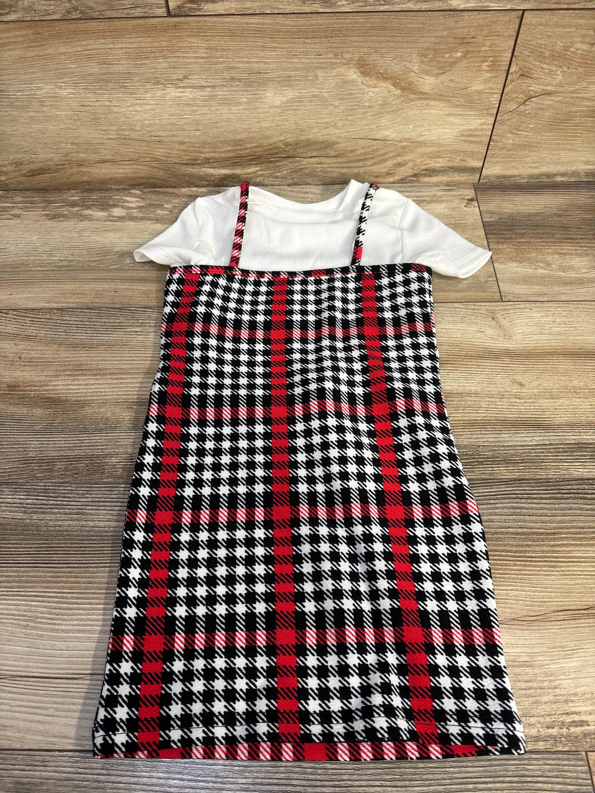 Top-down view of Shein 2pc ribbed shirt and tank dress set showcasing the white ribbed shirt and patterned dress on a wood floor