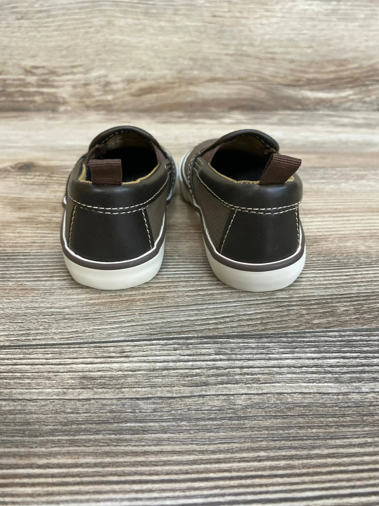 Side view of Gap toddler slip-on sneakers in brown, size 6C showing elastic goring and white rubber sole on white background