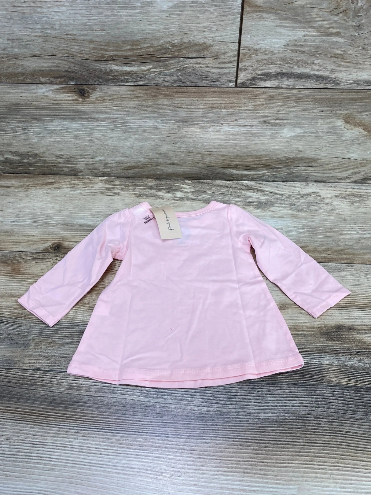 Front view of pink First Impressions baby shirt size 3 to 6 months showing birdie graphic on white background