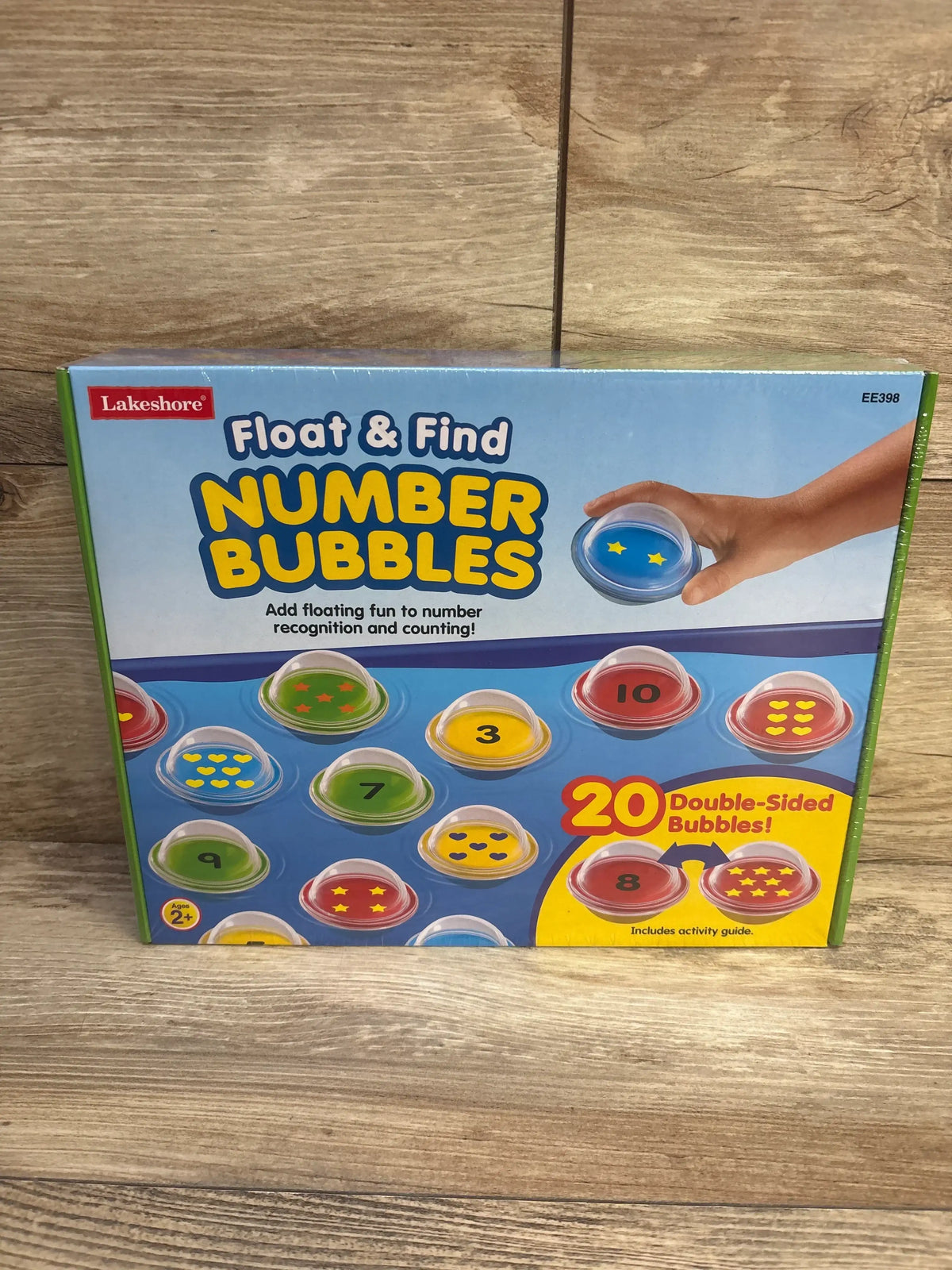 Front of Lakeshore Float & Find Number Bubbles box showing colorful double-sided floating number bubbles on wooden surface