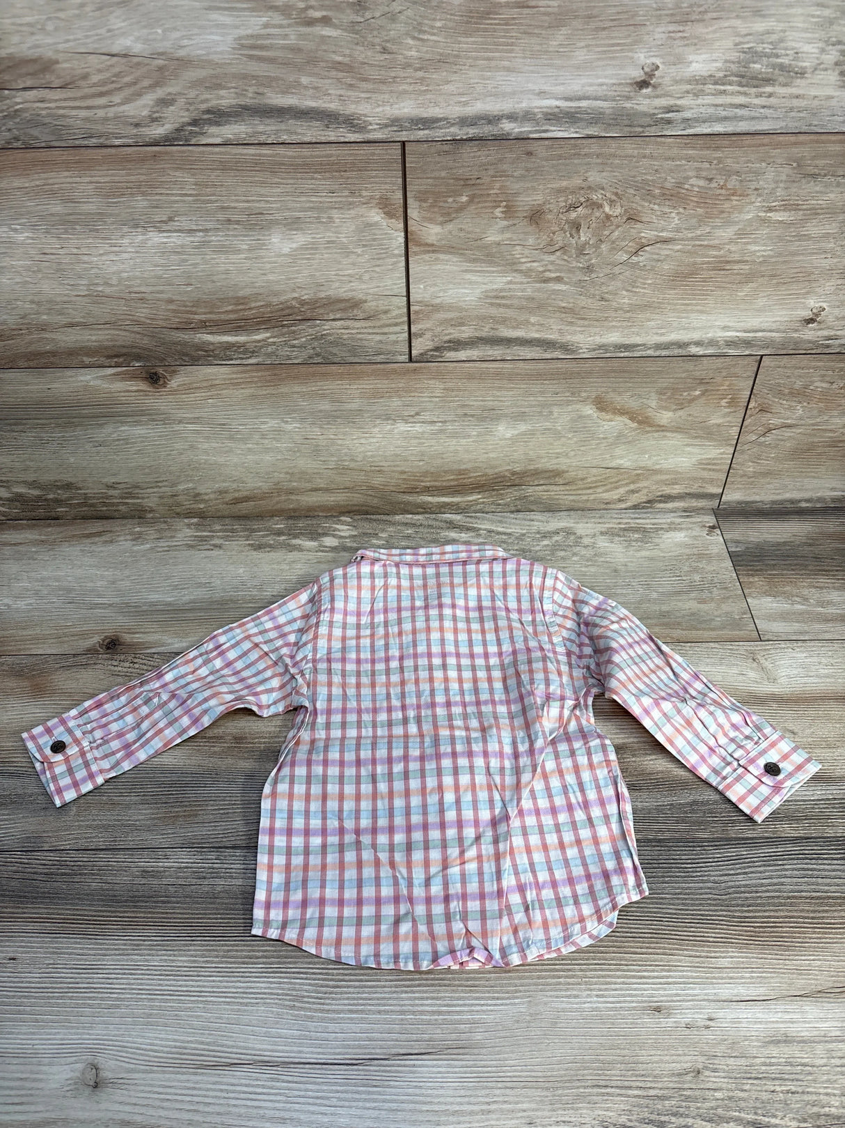 Back view of Cat & Jack 18-month toddler plaid button-up shirt showcasing long sleeves and button cuffs on wood floor background