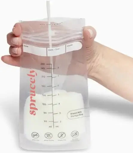Front view of a Sprucely breastmilk storage bag showcasing milliliter and ounce measurement markings, held against a white background