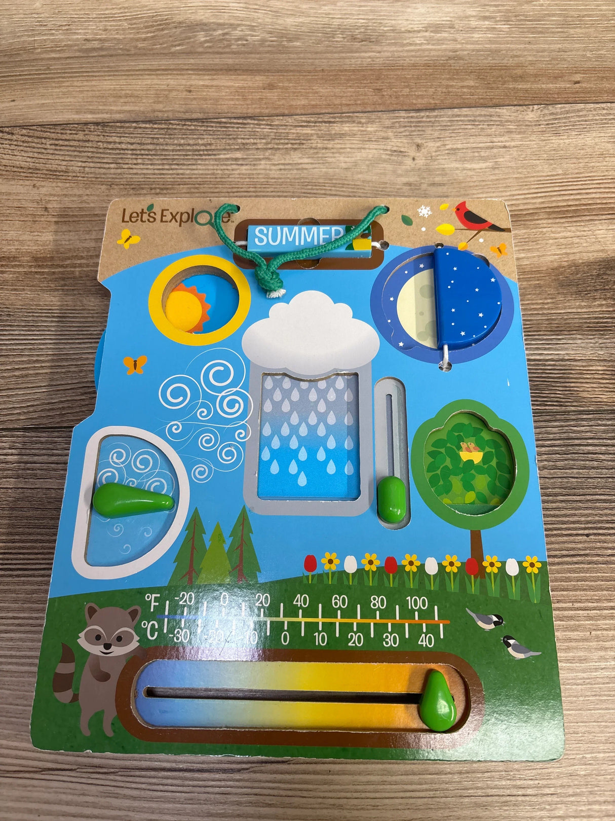 Let’s Explore wooden weather toy with rotating sun and moon, raindrops, wind dial, and temperature slider on wood background