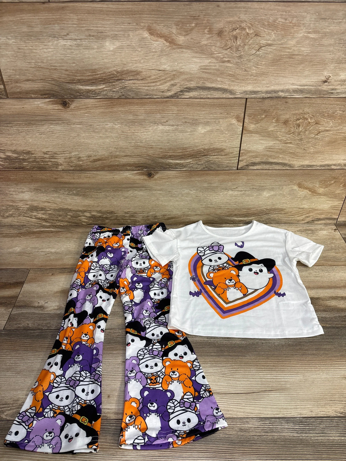 Halloween-themed kids outfit with cute bear print pants and matching white tee