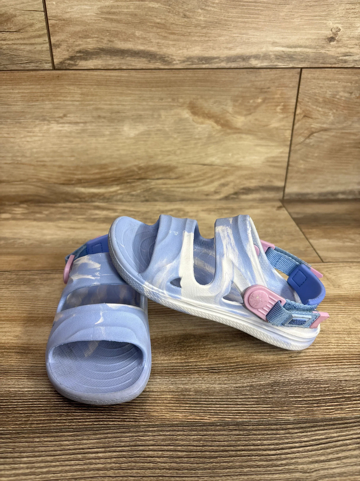 Side view of Rugged Shark toddler sandals in blue showing adjustable strap and textured sole on white
