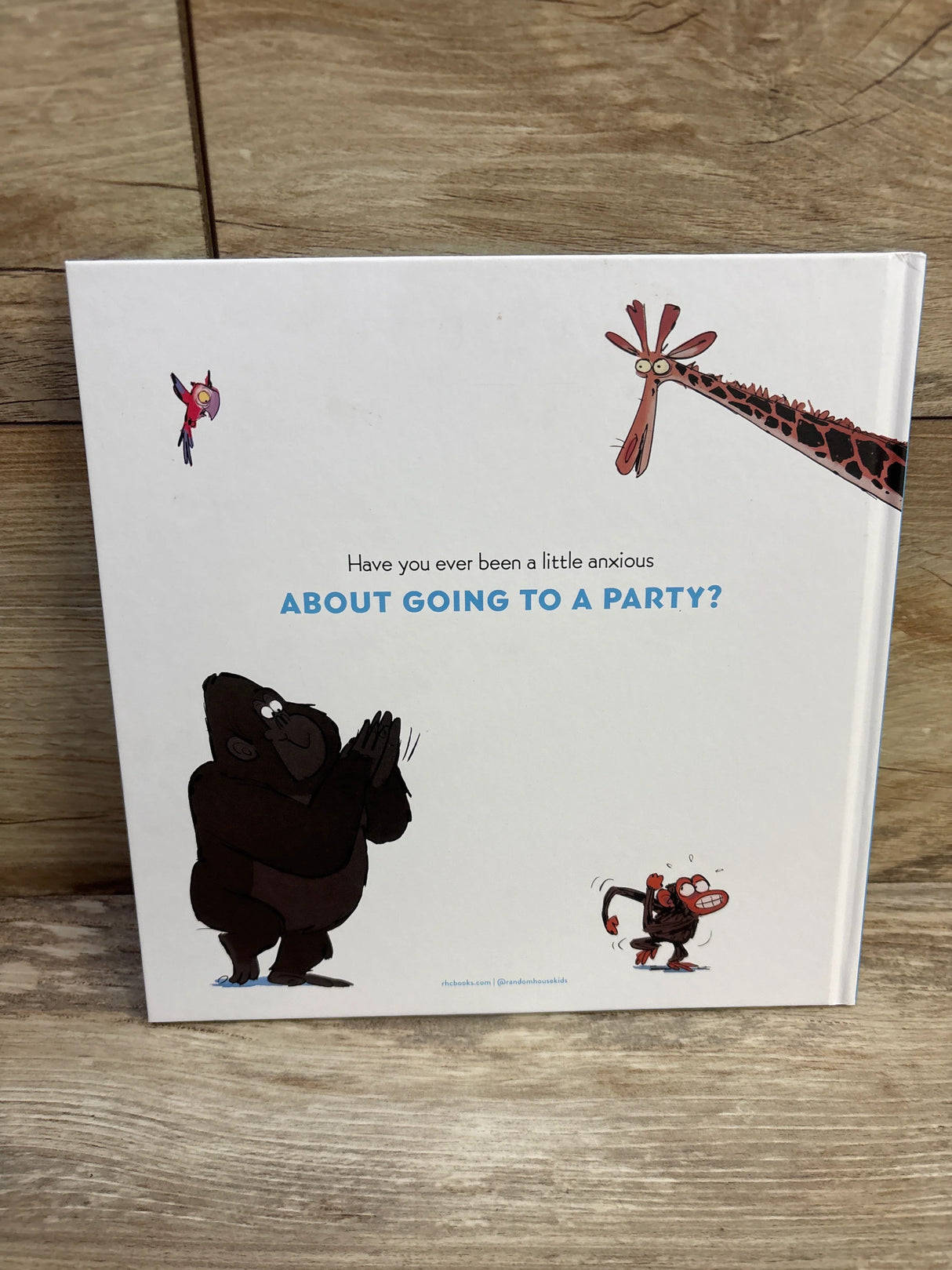 Back cover of Grumpy Monkey Party Time! hardcover showing headline ABOUT GOING TO A PARTY? and animals on a wooden surface