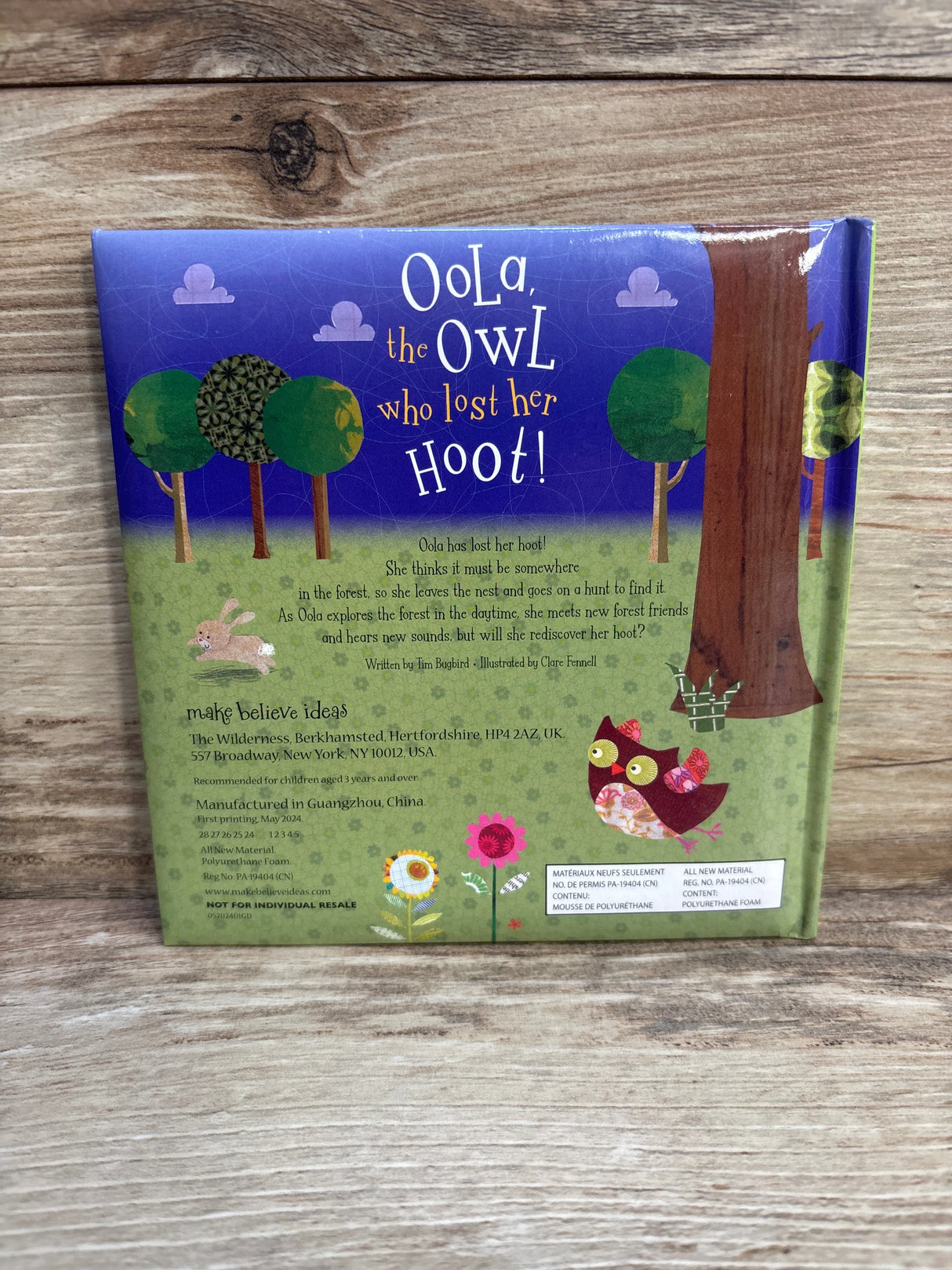 Back cover of 'Oola the Owl Who Lost Her Hoot!' children's book on wood background