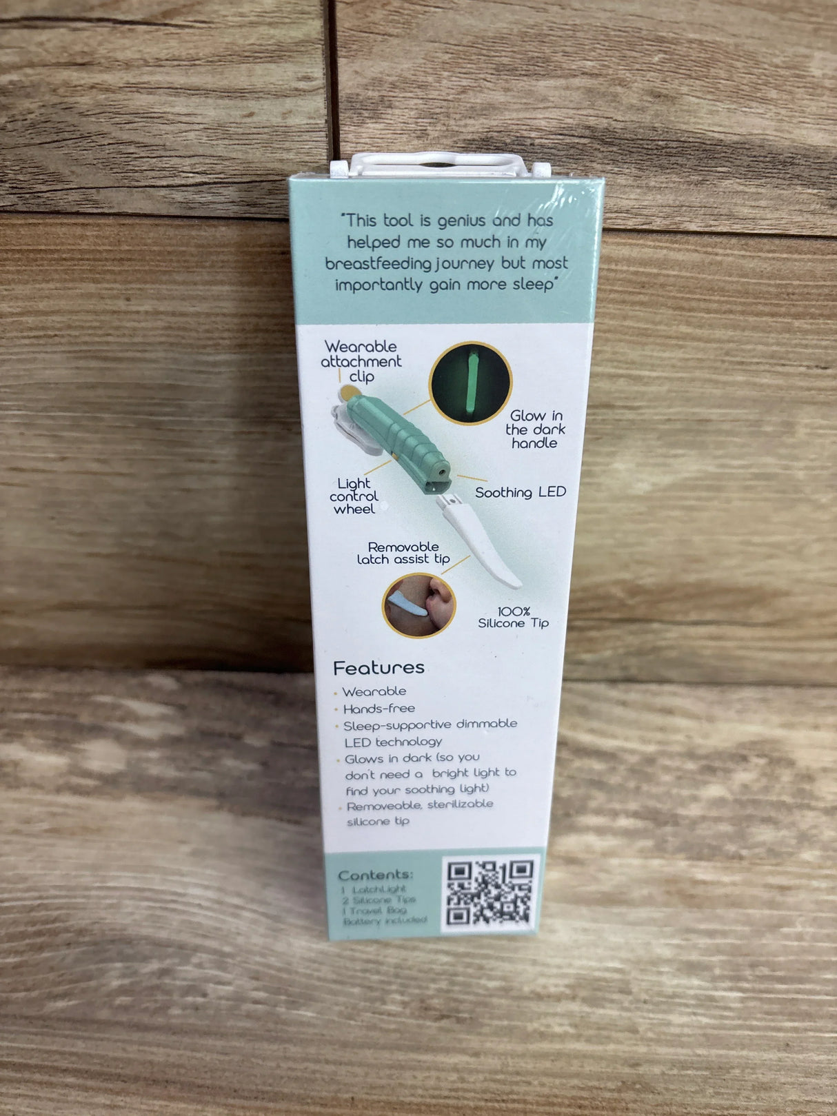 LatchLight breastfeeding aid box features wearable clip, soothing LED, and silicone tip.