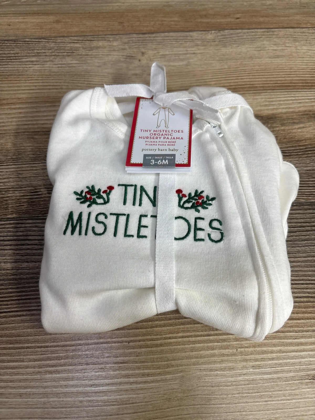 White organic baby pajamas with 'Tiny Mistletoes' embroidery, size 3-6M, holiday-themed nursery wear