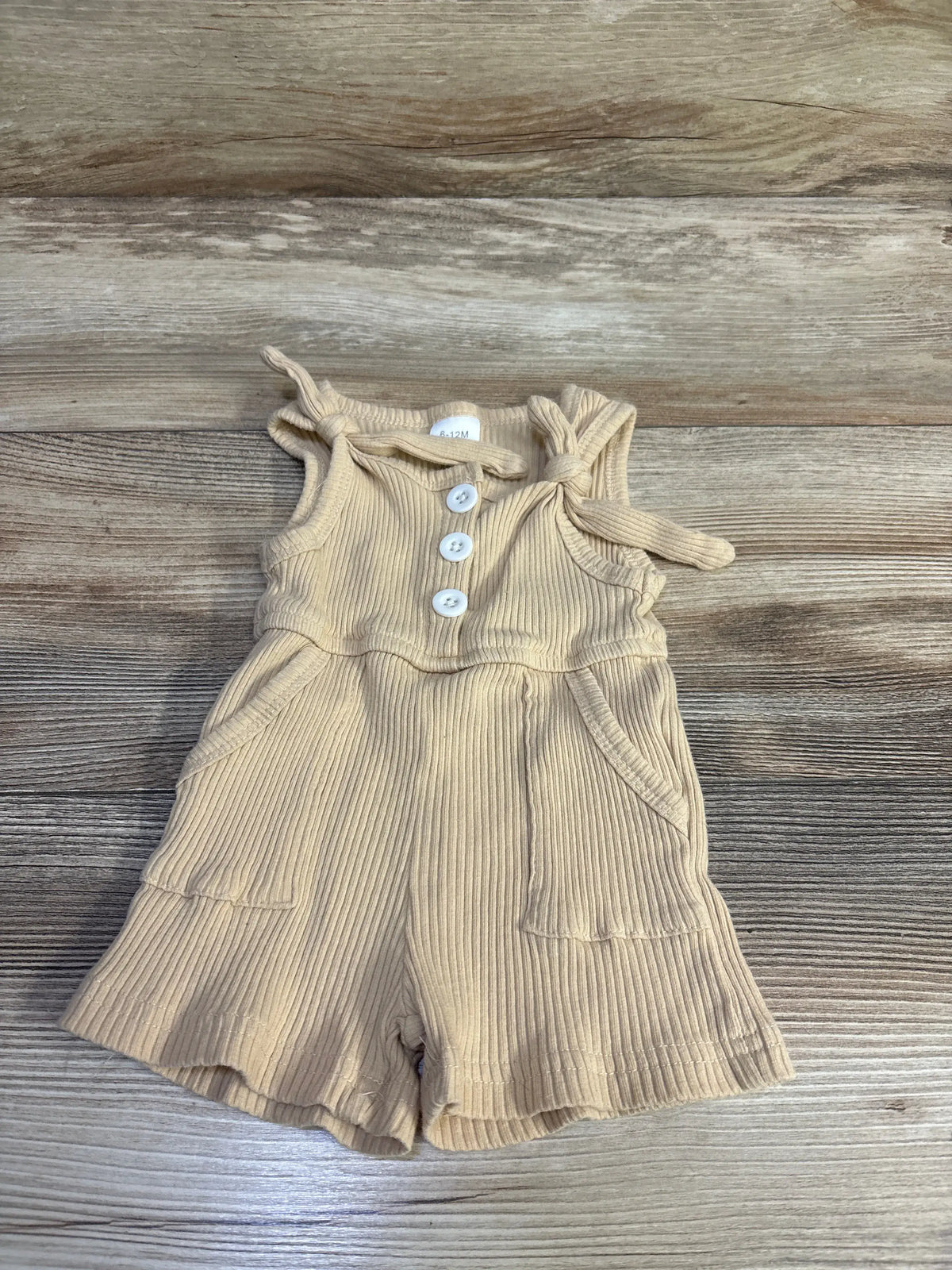 Beige ribbed baby romper with tie shoulders and button front for size 6-12m