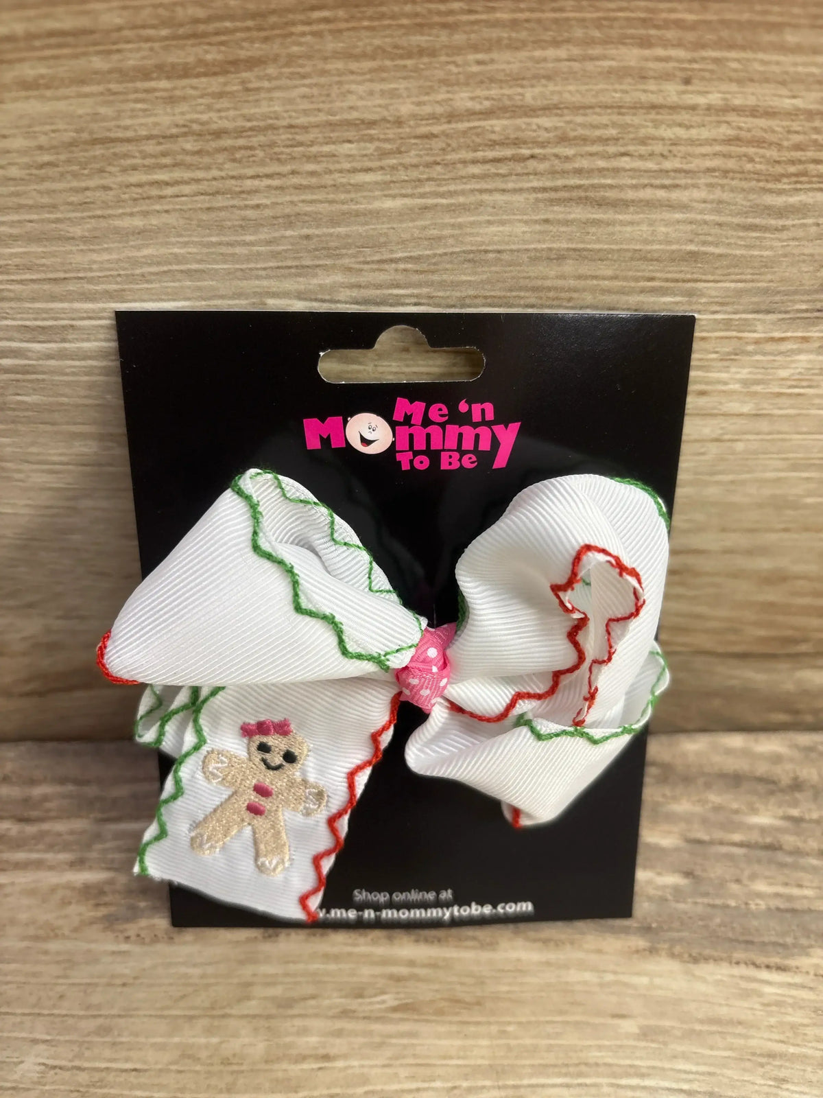 White holiday bow with gingerbread girl, red and green trim, pink polka dot center for kids' hair accessories