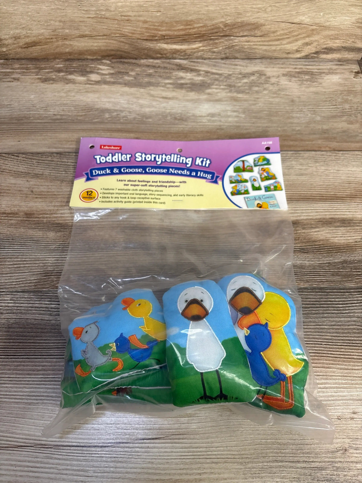 Front view of Lakeshore Duck & Goose, Goose Needs a Hug 7-piece storytelling kit with soft cloth characters in clear packaging