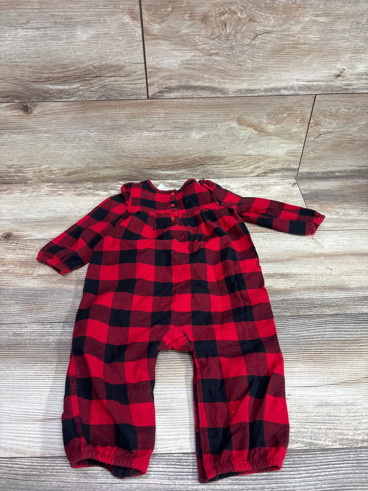 Baby Gap red and black buffalo plaid coveralls for infants size 6-12m on a wood background
