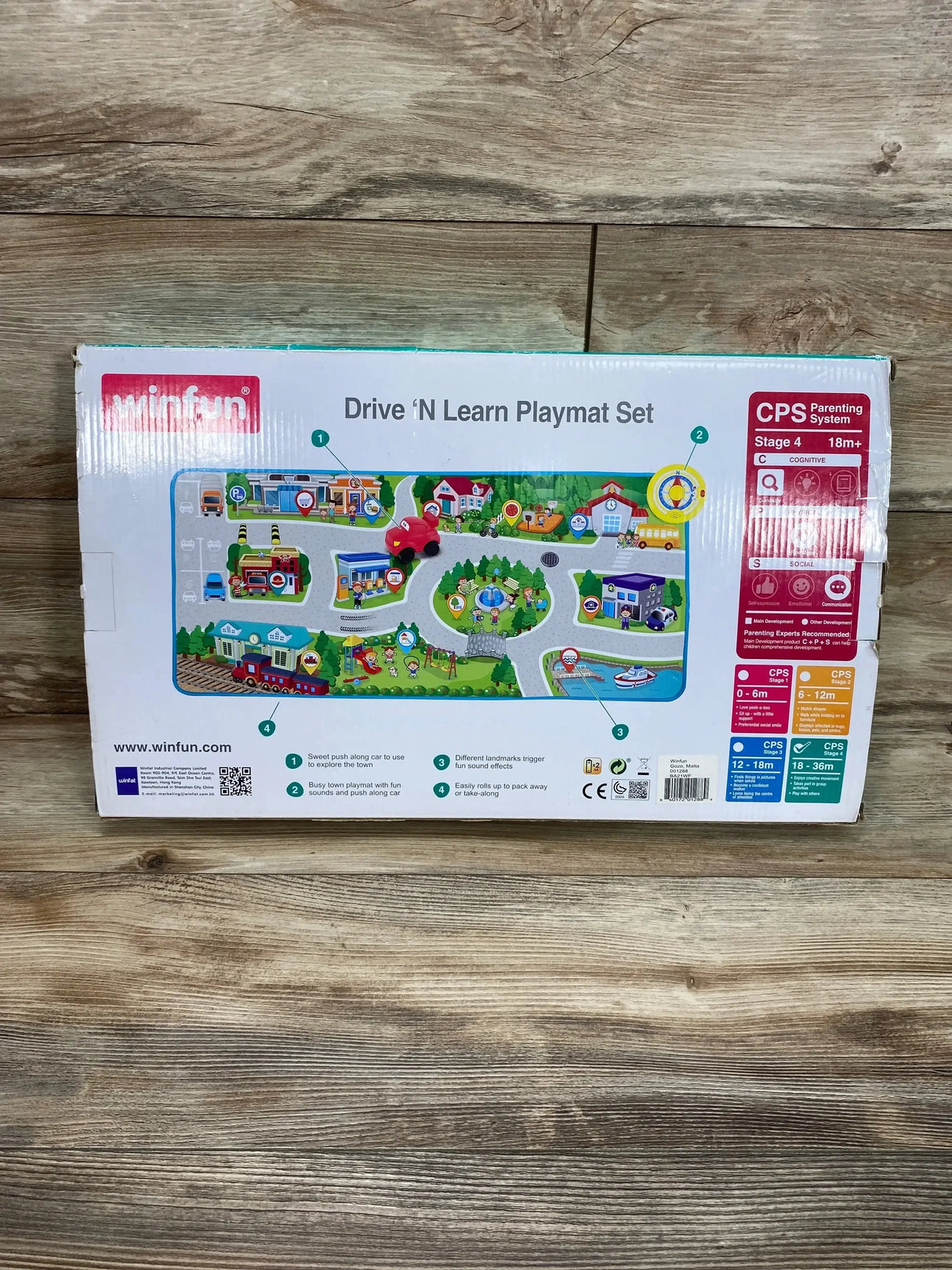 Front view of Winfun Drive ‘N Learn Playmat Set box showcasing illustrated road playmat and red toy car on wood floor