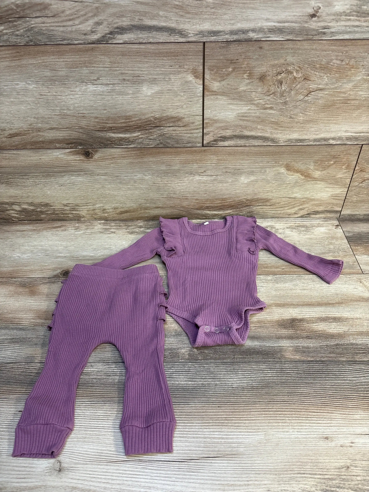 Purple ribbed baby onesie and leggings set with ruffles, ideal for infant clothing resale