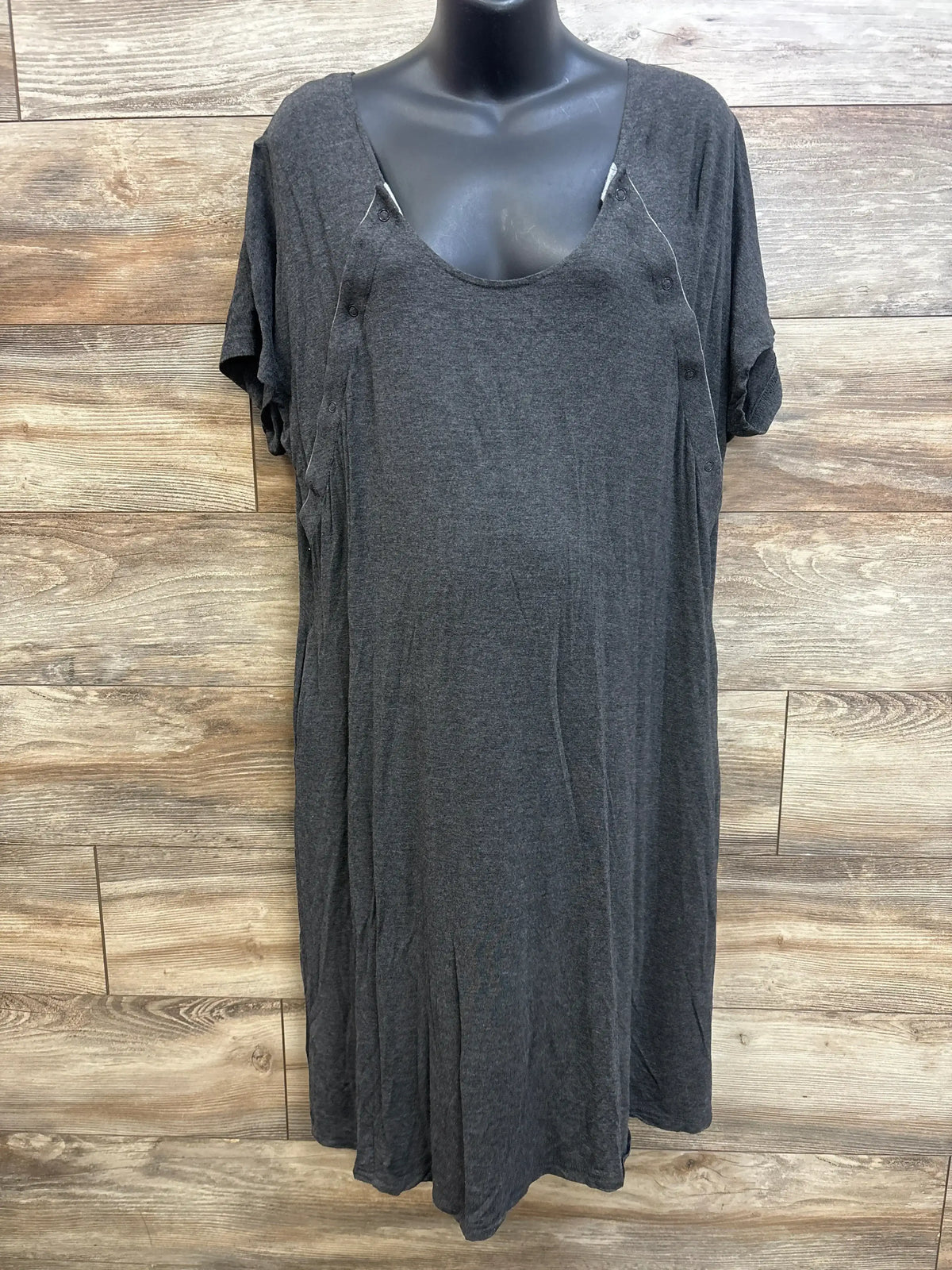 Front view of Frida nursing gown in grey showing scoop neck, short sleeves and snap-front nursing access on wood background