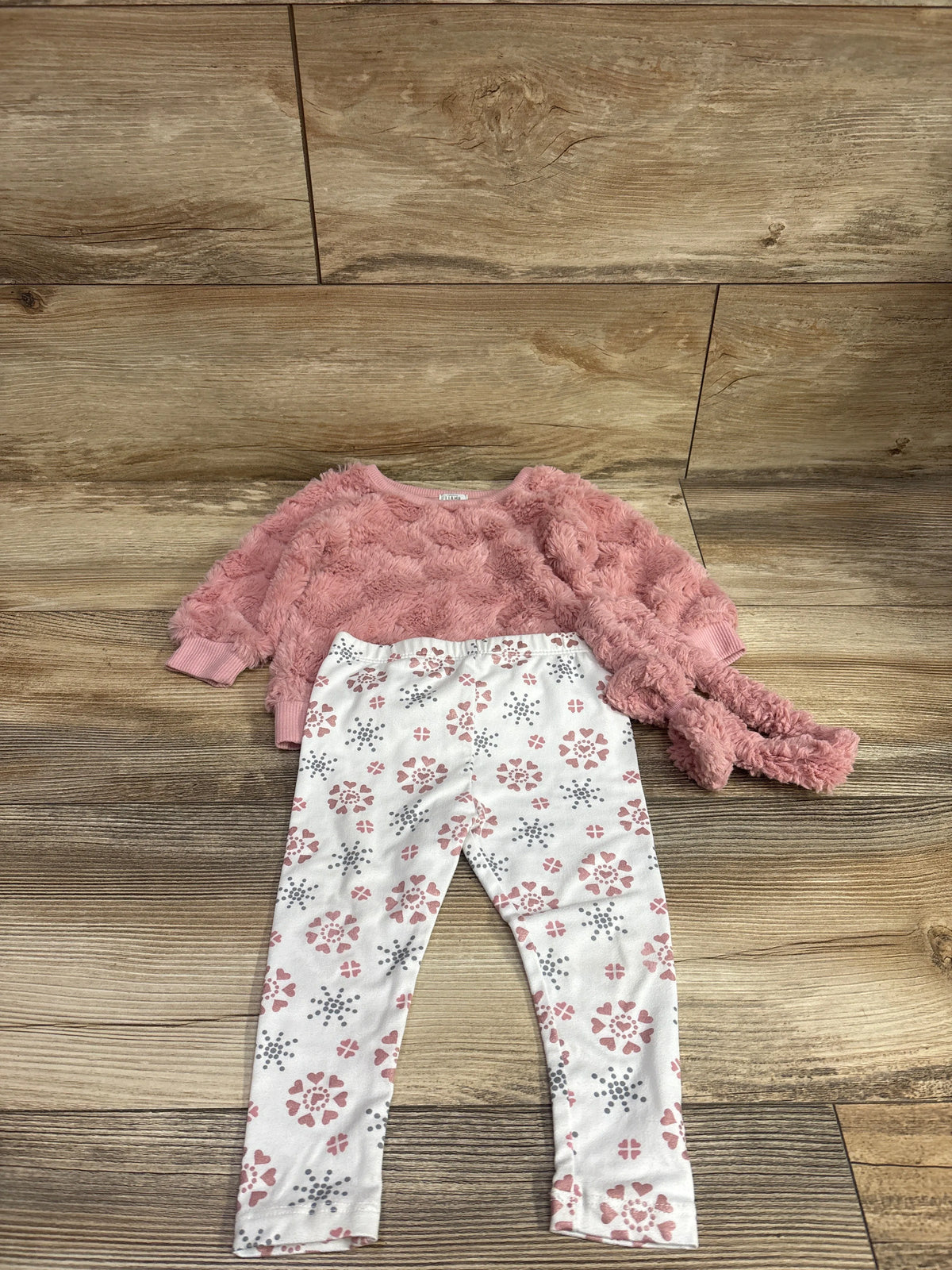 Top view of Laughing Llama 3pc plush sweatshirt pants and headband set in pink with floral pants on wood flooring