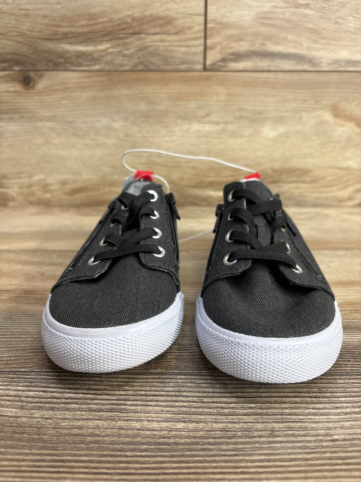 Front view of Cat and Jack Lucian double-zipper sneakers in grey canvas with white rubber soles on wooden floor