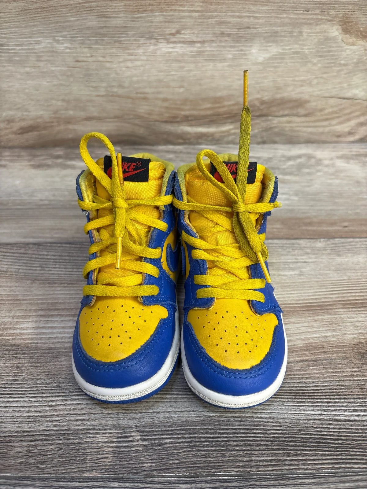 Front view of Air Jordan 1 Retro High OG TD Reverse Laney sneakers showing Varsity Maize and Game Royal leather uppers
