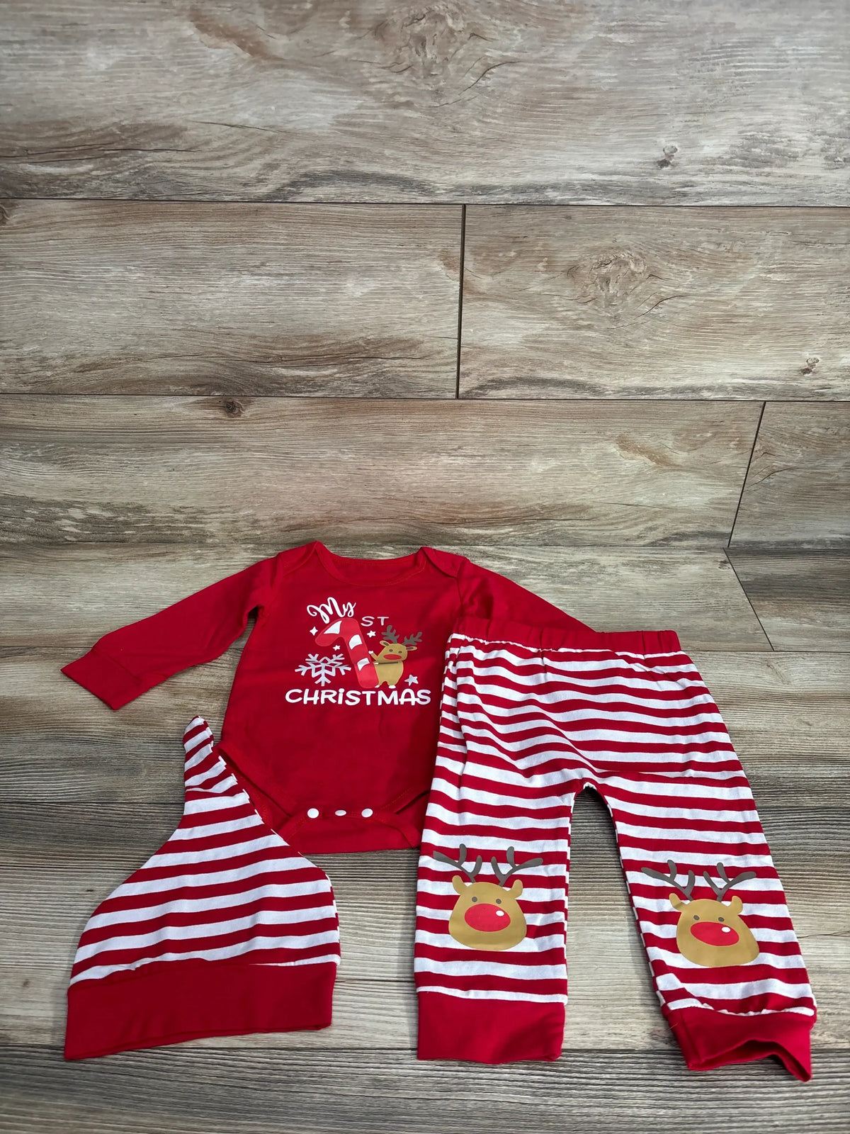 Red 'My First Christmas' baby onesie with reindeer, striped pants & hat set for holiday photos
