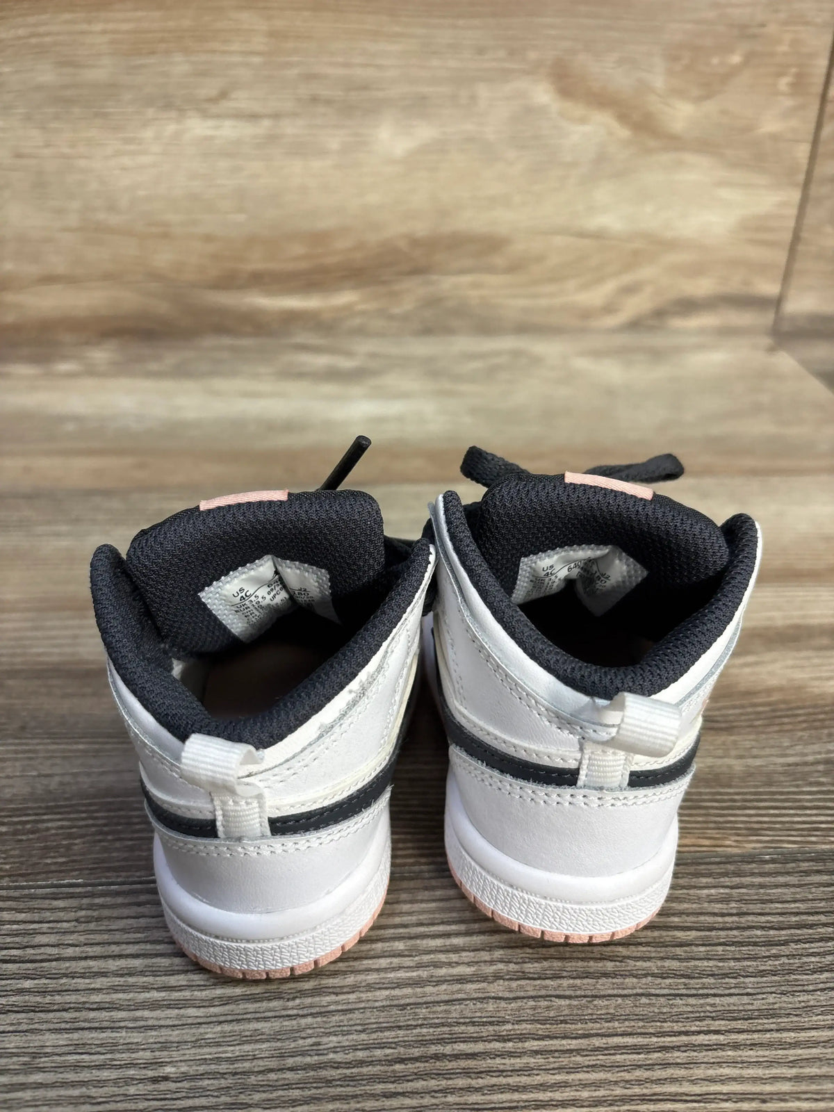 Rear view of white and grey Air Jordan 1 Mid TD White Arctic Orange toddler sneakers.
